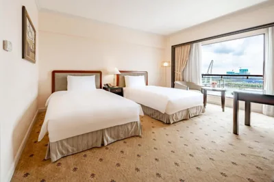 Deluxe Twin Room nhìn ra sông — Lotte Hotel Saigon